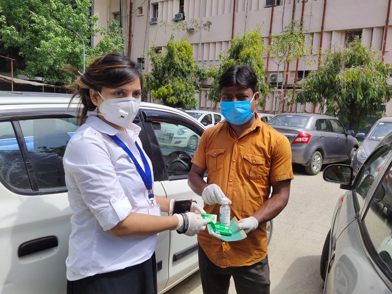 One of our outreach workers distributing hygiene product